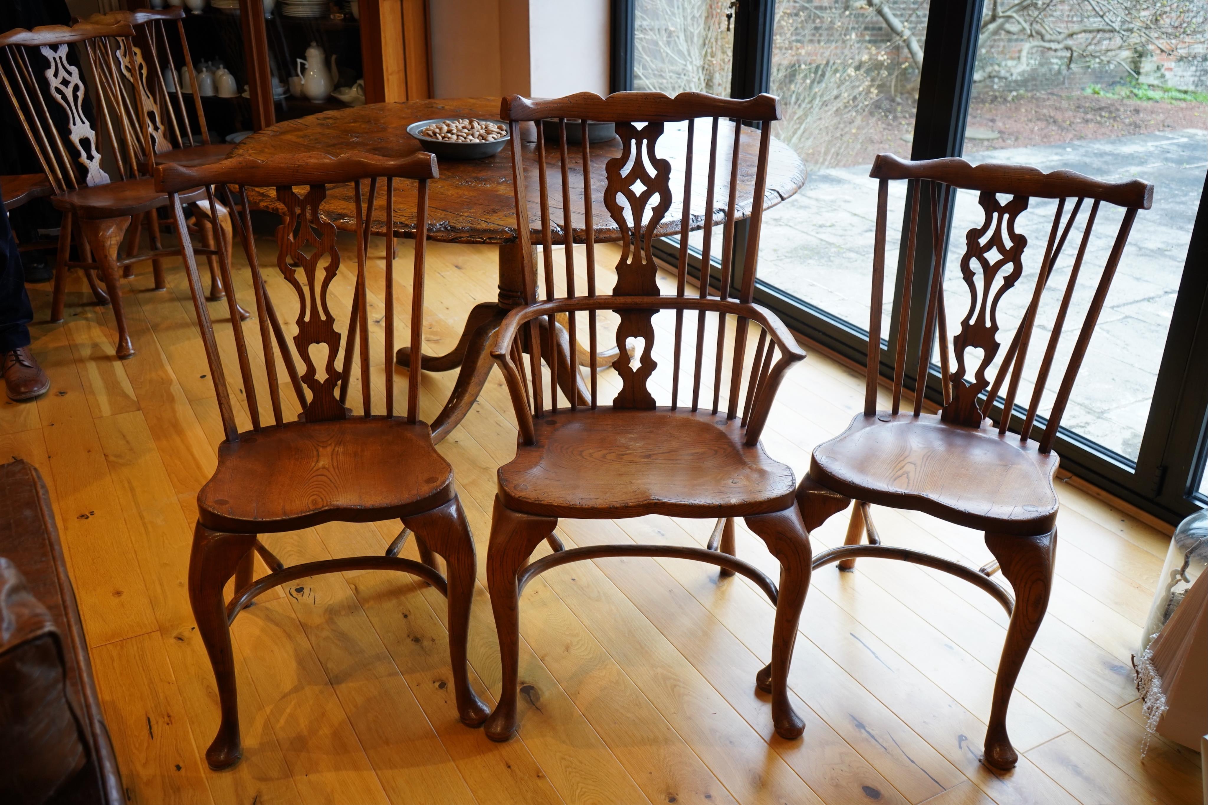 A set of six Titchmarsh & Goodwin elm Windsor chairs, two with arms. Condition - fair to good